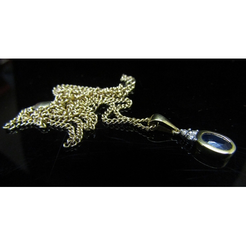 5141 - An 18ct gold sapphire and diamond pendant hung on a 9ct gold chain, 50cm long, 4.7g   (R) £60