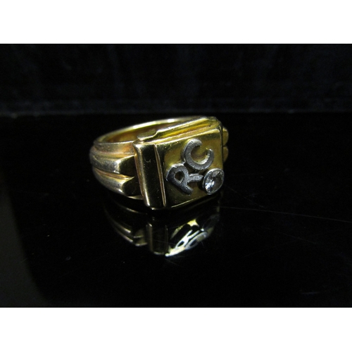 5145 - A gold ring unmarked, with raised initials RC and single diamond in rubover setting, 0.20ct approx. ... 