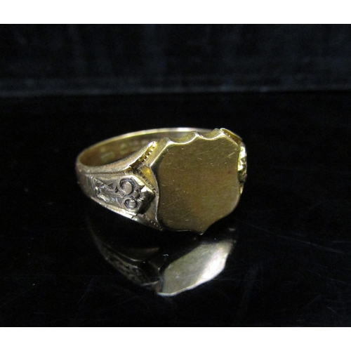 5146 - An 18ct gold signet ring, vacant shield shape front, engraved shoulders. Size Z3, 9.5g