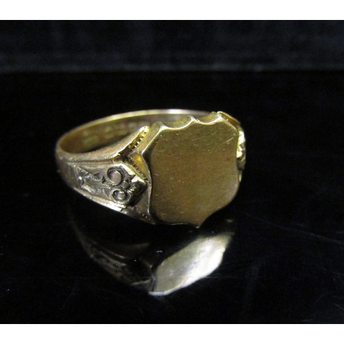 5146 - An 18ct gold signet ring, vacant shield shape front, engraved shoulders. Size Z3, 9.5g