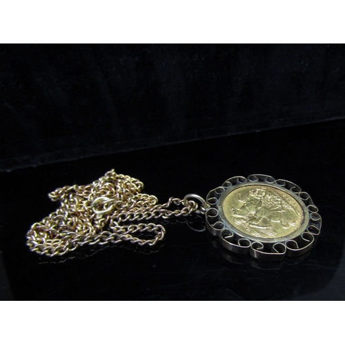 5147 - A 1918 gold sovereign in loose pendant mount hung on a neckchain stamped 9ct gold, 18g total