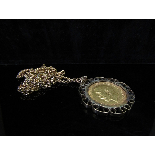 5147 - A 1918 gold sovereign in loose pendant mount hung on a neckchain stamped 9ct gold, 18g total