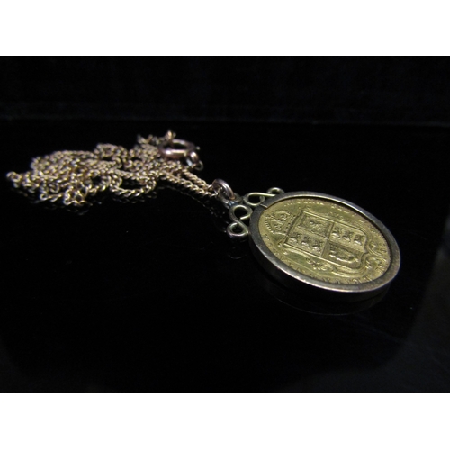 5148 - An 1892 gold half spade guinea in loose pendant mount hung on chain, stamped 9ct, 8.6g