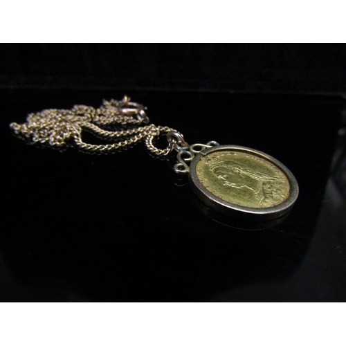 5148 - An 1892 gold half spade guinea in loose pendant mount hung on chain, stamped 9ct, 8.6g