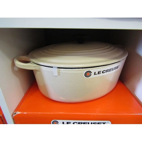 1274 - A boxed Le Creuset oval casserole dish and lid in cream, 29cm