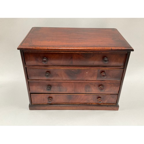 8026 - A Victorian mahogany tabletop apprentice chest with four long drawers, plinth base, some losses, 30.... 