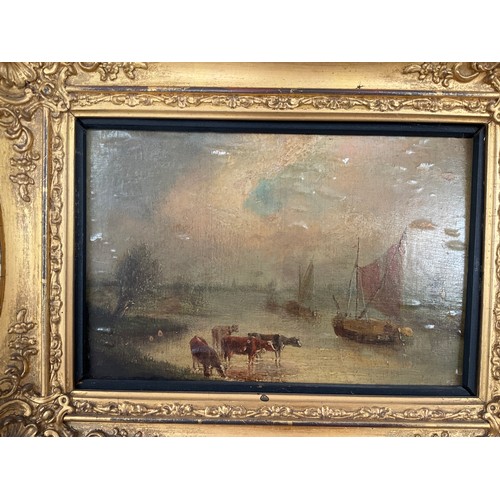 8043 - A pair of 19th Century oils on board depicting riverscapes, windmills and cattle grazing, oil bubble... 