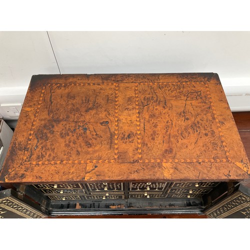 8022 - An 18th Century walnut collector's cabinet, the herringbone inlaid outer case with two doors opening... 