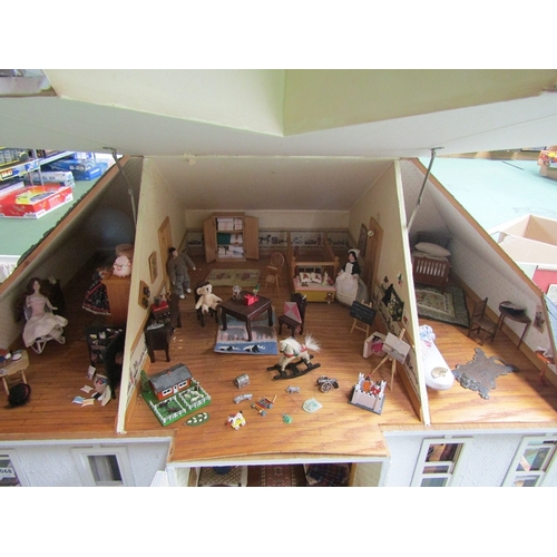 7068 - A large American kit built two storey dolls house with attic above, furnished with a good collection... 