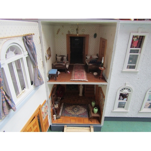 7068 - A large American kit built two storey dolls house with attic above, furnished with a good collection... 