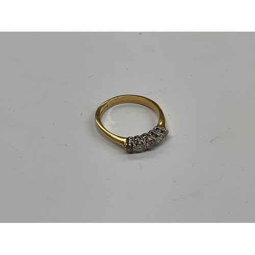 8103 - An 18ct gold graduated five stone diamond ring, size T, 3.8g