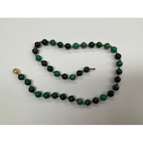 8105 - A green jasper bead necklace with gold clasp stamped 585, 41cm