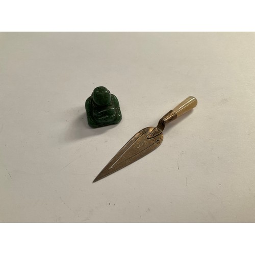 8120 - A silver page marker with mother of pearl handle in the form of a trowel and a jade miniature Buddha