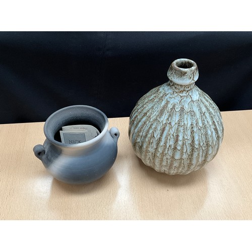 8133 - Muchelney Pottery: A smoke fired vase, dated ‘98, together with a Nick Reese bottle vase of ribbed f... 