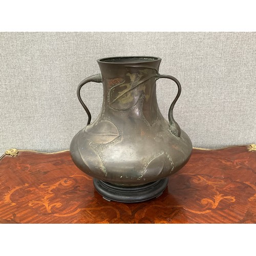 8137 - A late 19th/early 20th Century bronze vase in the Art Nouveau style, shaped handles, leaf relief, 33... 