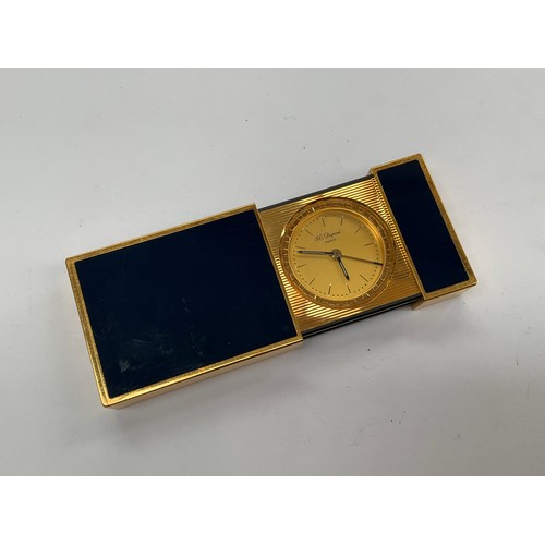 8140 - A Dupont of Paris travelling pocket alarm clock, gilt metal with blue panels