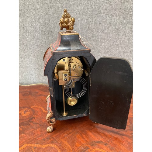 8150 - A 19th Century boullework clock, fruit finial over an ormolu mounted scrolled foliate case, on ball ... 