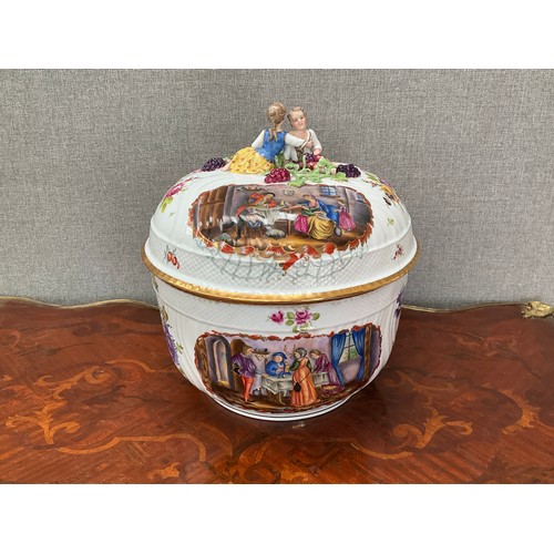 8169 - A modern German porcelain table centrepiece, the lid surmounted by young couple, over hand painted s... 