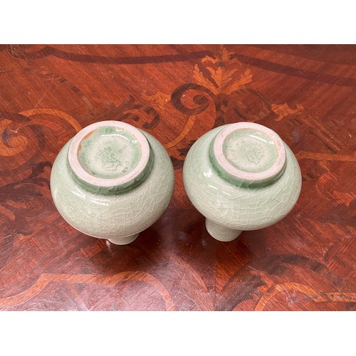 8171 - A pair of Chinese celadon glaze vases, bulbous form, 10.5cm tall