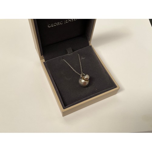 8175 - A Georg Jensen Cave pendant on chain, boxed