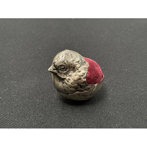 8277 - A silver pincushion of a chick hatching from an egg, marks rubbed, Chester