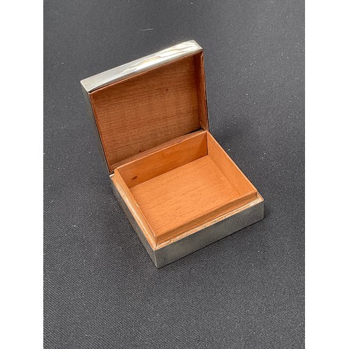 8283 - A silver square form trinket box with wooden lining, the hinged lid with a Royal Worcester panel dep... 