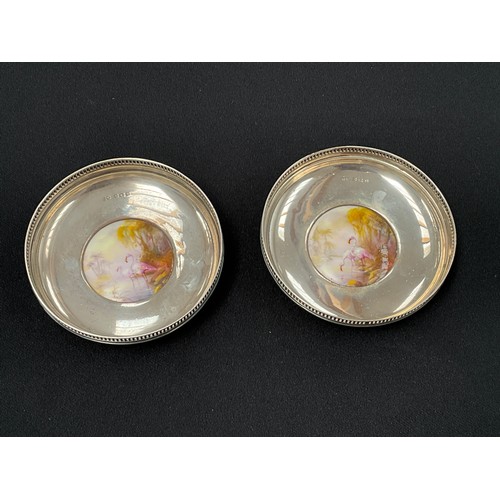 8284 - A pair of Sanders and Mackensie silver trinket dishes each with a Royal Worcester roundel depicting ... 