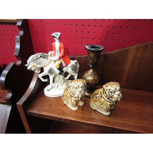 82 - A pair of ceramic Bulldog figures, a dandy on horse back and a laquered Indian candlestick (4)