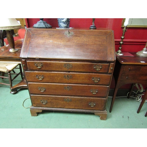 119 - A George II oak bureau the fall having working lock and key over four graduating long drawers on bra... 