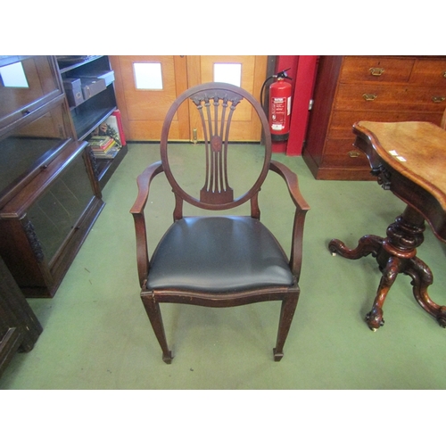 67 - An Edwardian mahogany carved splayed back elbow chair with tapering fore legs to spade feet, a/f    ... 