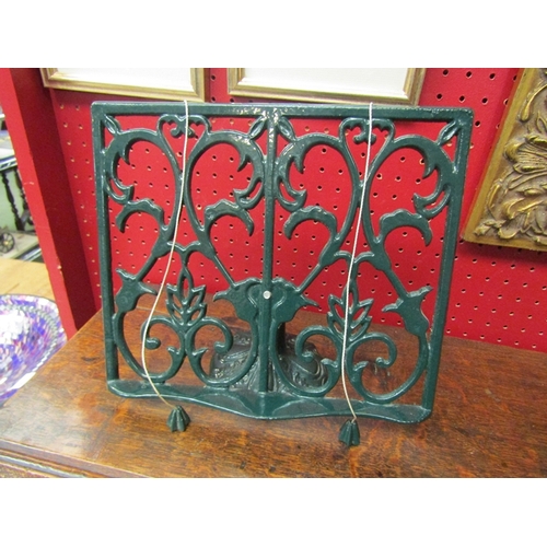 117 - An ornate cast book stand   (R) £15