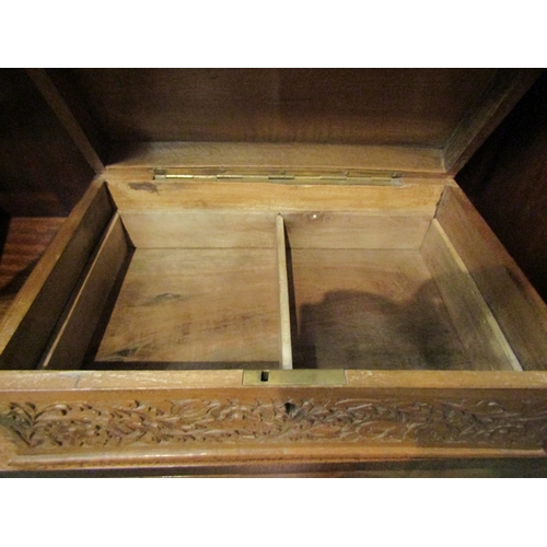 86 - A sewing/jewellery box with Eastern heavily carved floral design.