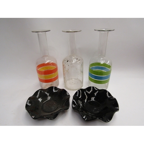 413 - Three glass decanters including two with colourful band design and two frilled glass dishes