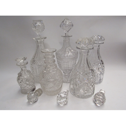 450 - Six various cut glass decanters together with three stoppers