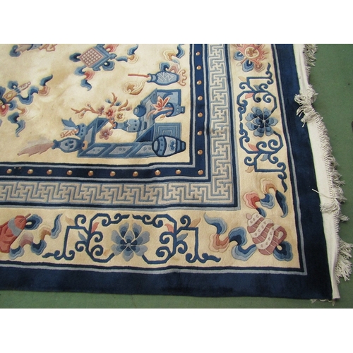 453 - A large hand knotted wool Chinese rug in cream and blue tones, scenes of flora and fauna, tasselled ... 