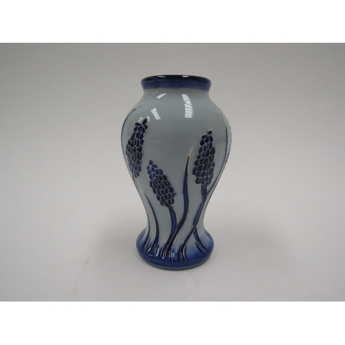 8057 - A Moorcroft Muscari blue on blue pattern miniature vase, 10cm tall, boxed