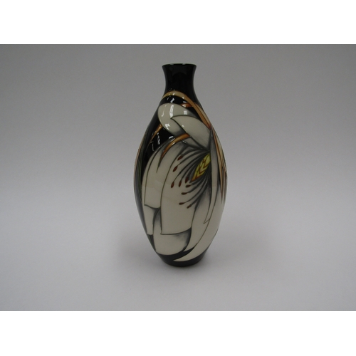 8063 - A Moorcroft Moonflower pattern vase by Philip Gibson, No.45, 24cm tall, boxed