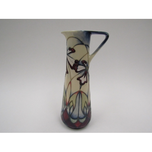 8068 - A Moorcroft Cockleshell Orchid pattern jug, Trial 4.4.02, 24cm tall, boxed