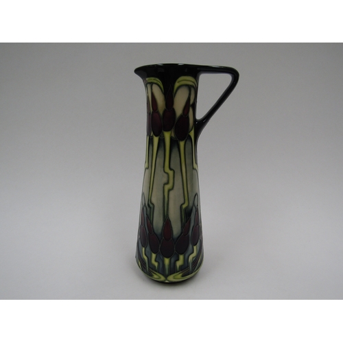 8071 - A Moorcroft Moonlight Tulip pattern jug by Emma Bossons, 24cm tall, boxed