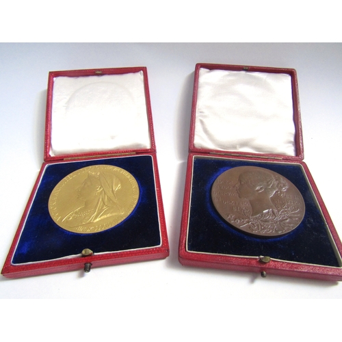 8083 - Two Queen Victorian diamond jubilee medalions 1837- 1897 in red leather cases, one gold and one bron... 