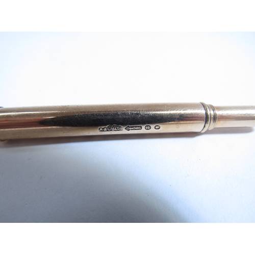 8086 - A 9ct gold propelling pencil, London A+C Ltd, 11.3g