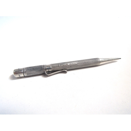 8092 - A silver pencil holder and silver propelling pencil