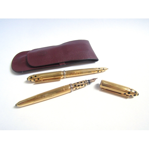 8123 - A set of Cartier Panthere cased pens, ballpoint and fountain, leather pouch, with certification, car... 