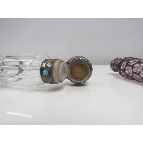 8191 - A double ended silver top scent bottle inset with small turquoise beads, together with others includ... 