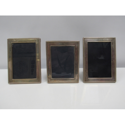 8204 - Three Carrs of Sheffield silver photograph frames with wrythen edge, two 1997 and one circa 1999. 18... 