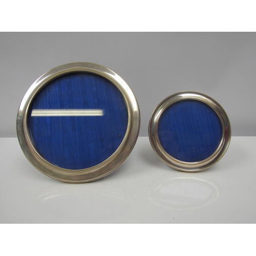 8208 - Two WI Broadway & Co. silver circular photograph frames, Birmingham 1996, 20.5cm and 14cm diameters