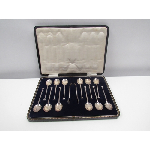 8212 - A set of twelve John Sanderson & Son Ltd tea spoons and tongs. 133g