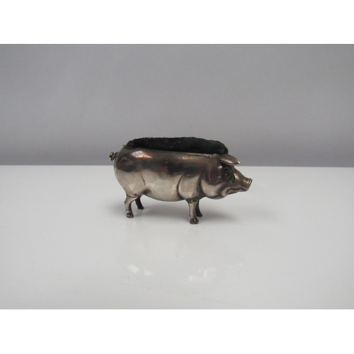 8215 - An Edwardian Adie & Lovekin Ltd silver pig pin cushion, Birmingham 1904. 7cm long