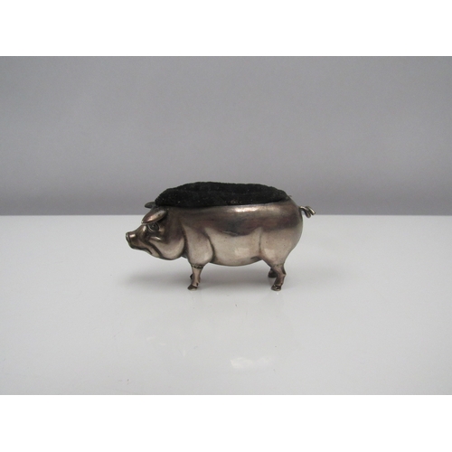 8215 - An Edwardian Adie & Lovekin Ltd silver pig pin cushion, Birmingham 1904. 7cm long