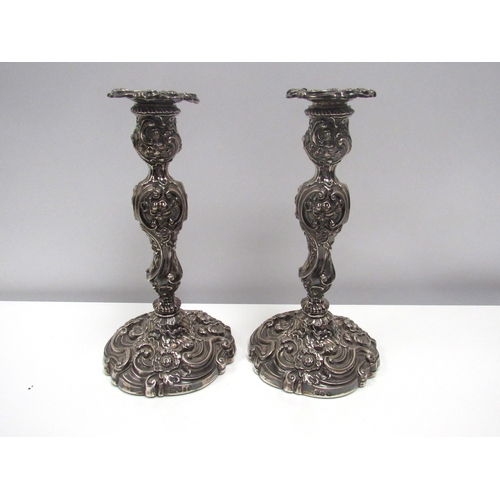 8225 - A 19th Century pair of James Kirkby, Gregory & Co. embossed candlesticks with wrythen base, Sheffiel... 